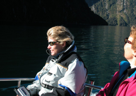 Elizabeth in boat at Milford Sound, New Zealand